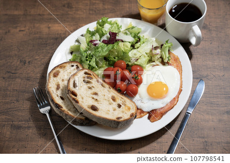 One plate breakfast, coffee and orange juice One plate breakfast, coffee and orange juice 107798541