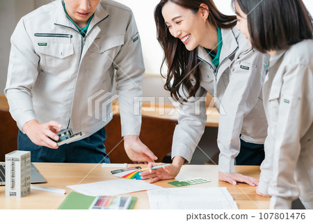 An engineer formulating a construction plan based on a model An engineer formulating a construction plan based on a model 107801476