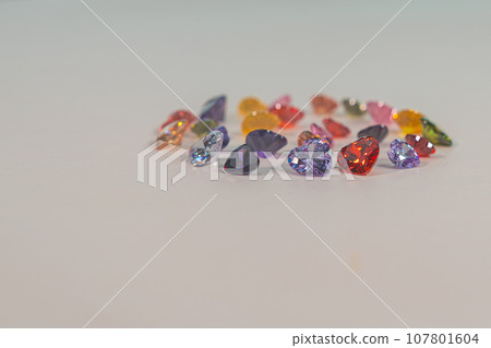 .Beautiful multi-colored heart-shaped diamonds set in a circle. 107801604