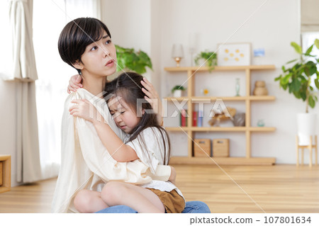 mother soothing her child mother soothing her child 107801634