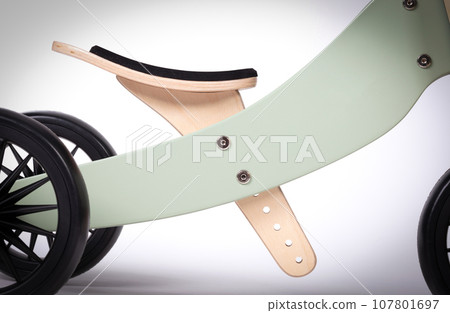 Wooden balance bicycle or run bike closeup 107801697