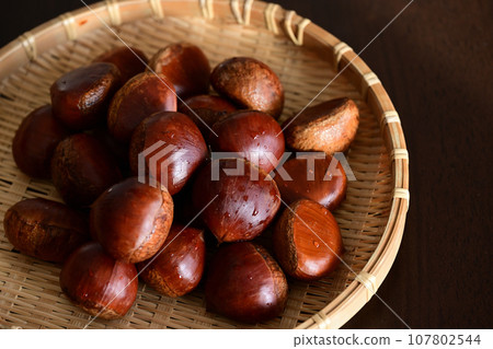 Autumn taste: Chestnuts in a colander Autumn taste: Chestnuts in a colander 107802544