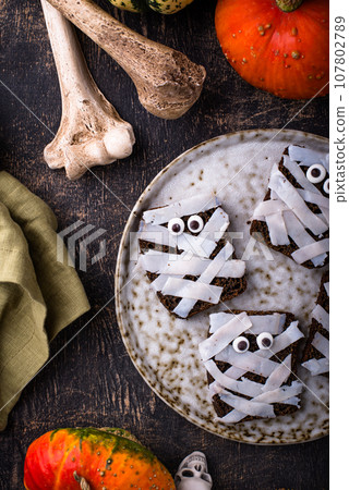 Halloween snack in shape of mummy. 107802789