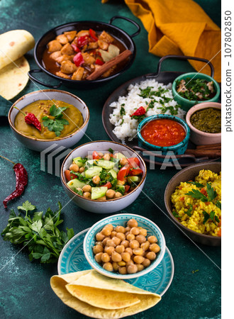 Assorted of traditional Indian food. 107802850