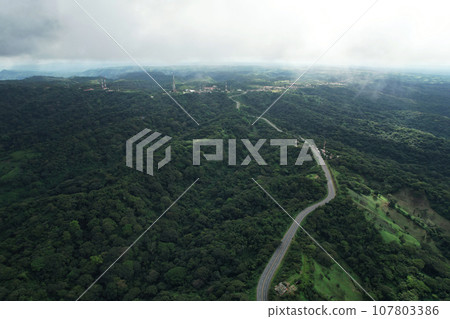 Green hills with mountain road Green hills with mountain road 107803386