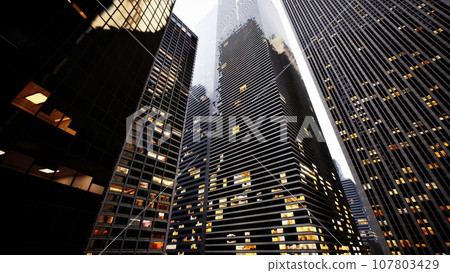 A city skyline illuminated at night with towering buildings A city skyline illuminated at night with towering buildings 107803429
