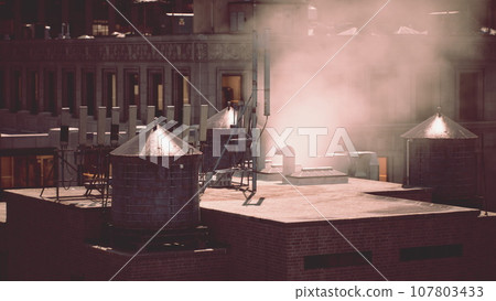 Smoke rising from a chimney on the roof of a building 107803433