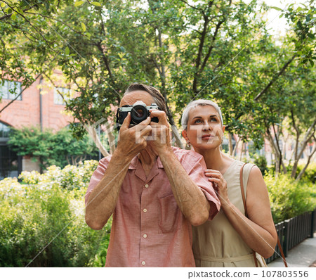 film camera, couple, senior 107803556