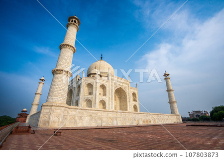 White domes and white towers under blue sky and white clouds. White domes and white towers under blue sky and white clouds. 107803873