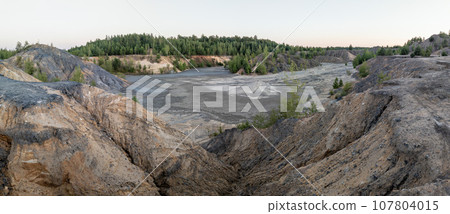 eroded soil quarry ravine with forest on its edge at summer evening panoramic photo eroded soil quarry ravine with forest on its edge at summer evening panoramic photo 107804015