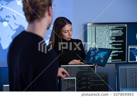 Cyber security team working in a Cyber Security Operations Center SOC to protect systems and technologies Cyber security team working in a Cyber Security Operations Center SOC to protect systems and technologies 107804983
