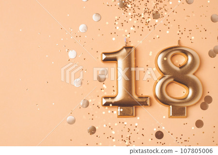 Gold candles in the form of number eighteen. 107805006