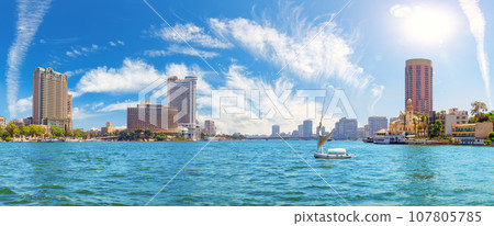 The Nile river view with boats and luxury hotels in the downtown of Cairo, Egypt The Nile river view with boats and luxury hotels in the downtown of Cairo, Egypt 107805785