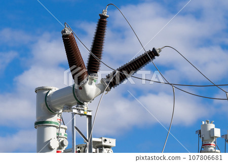 Electrical substation against the blue sky. Electrical substation against the blue sky. 107806681
