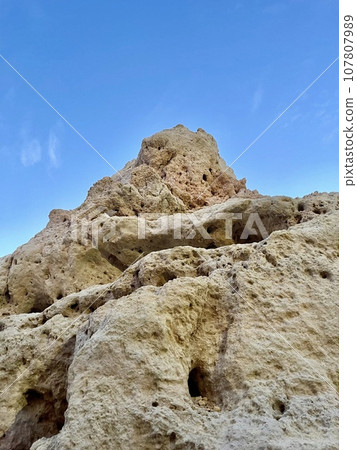 Reef formation from sandstone on the coast.Algar Seco, Carvoeiro. 107807989