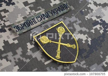 KYIV, UKRAINE - October 6, 2022. Russian invasion in Ukraine 2022. Ukraine Army Commander in Chief of the Armed Forces of Ukraine uniform badge. Text in Ukrainian - Armed Forces of Ukraine. KYIV, UKRAINE - October 6, 2022. Russian invasion in Ukraine 2022. Ukraine Army Commander in Chief of the Armed Forces of Ukraine uniform badge. Text in Ukrainian - Armed Forces of Ukraine. 107808705