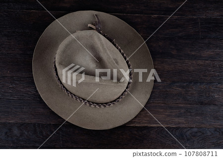 Old west hat on table. Top view. Old west hat on table. Top view. 107808711