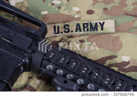 US Army M4 carbine with ammunitions on US Army uniform 107808748