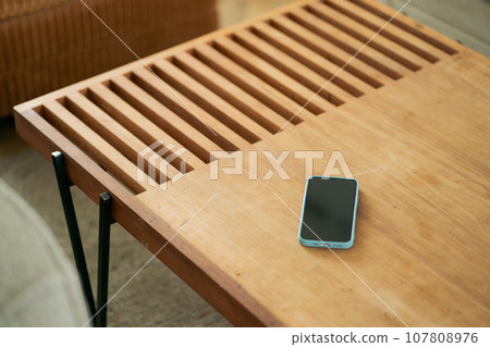 smartphone placed on the table 107808976