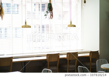 table and chairs by the window 107810214