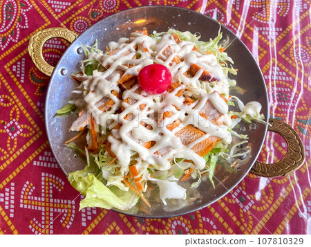 Chicken Caesar salad at an Indian curry restaurant Chicken Caesar salad at an Indian curry restaurant 107810329