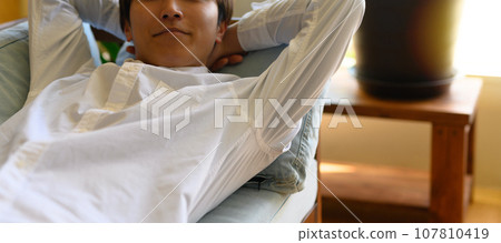 young man taking a nap 107810419