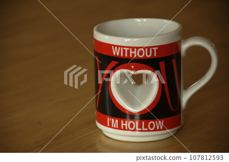 Cup on the table 107812593
