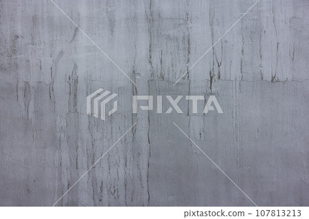 concrete outdoor wall with matte gray paint and black smudges - full-frame background and flat texture 107813213