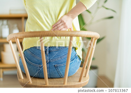 Women suffering from low back pain 107813367