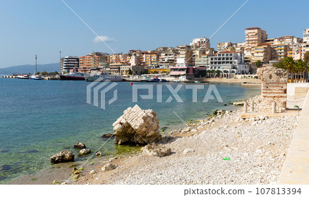 Sarande cityscape on Ionian Sea with residential area and harbor Sarande cityscape on Ionian Sea with residential area and harbor 107813394
