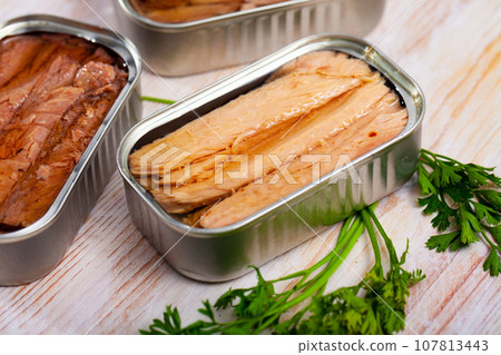 Preserved natural fillet of frigate tuna with parsley Preserved natural fillet of frigate tuna with parsley 107813443