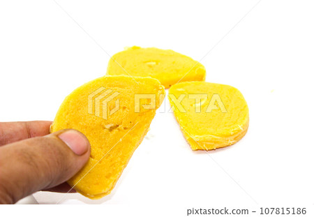 Gram flour sweets on white background with selective focus 107815186