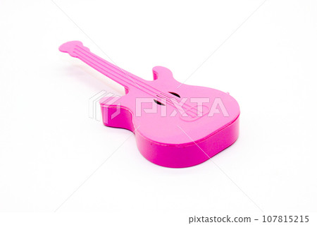 Toy guitar on white background with selective focus 107815215