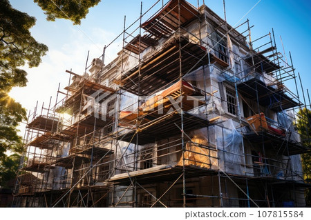 Front exterior view of net wrap scaffolding in front of building at construction site. Generative AI 107815584