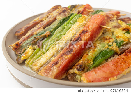 Korean holiday food skewers Jeon on white background 107816234