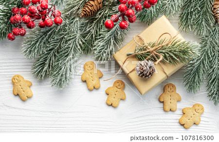 Christmas gifts, gingerbread cookies, decorations with christmas tree. Christmas gifts, gingerbread cookies, decorations with christmas tree. 107816300