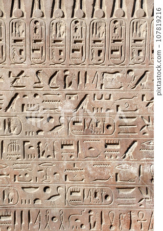 Ancient Egyptian hieroglyphs on stone wall, Karnak Temple Complex, Luxor, Egypt, Africa 107819216