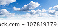 Cloudy blue sky 107819379