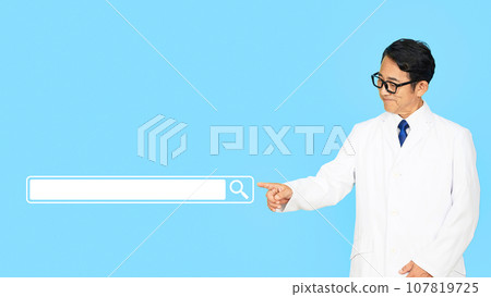 Middle-aged male doctor wearing a white coat pointing at the search window 107819725