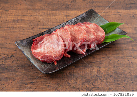 Thick-sliced beef tongue slices are essential for yakiniku 107821059
