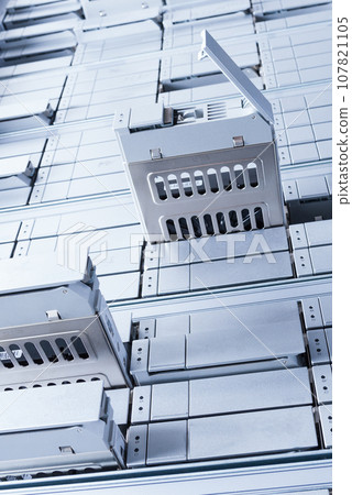 detail of data center with some of hard drive bays open 107821105