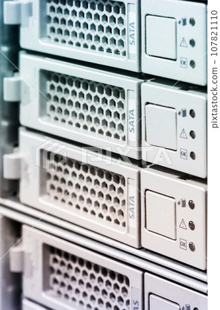 Row of hard drives serving as data storage inside server room Row of hard drives serving as data storage inside server room 107821110