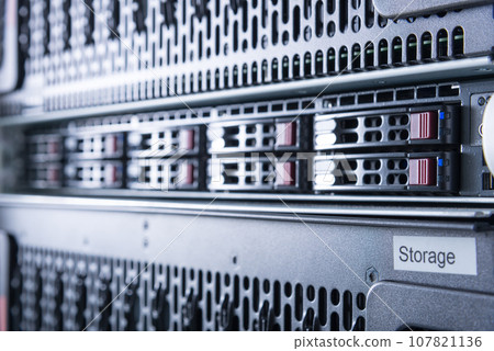 Row of hard drives serving as data storage inside server room Row of hard drives serving as data storage inside server room 107821136