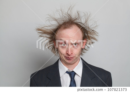 Frustrated businessman with hair up on white background, studio portrait 107821373