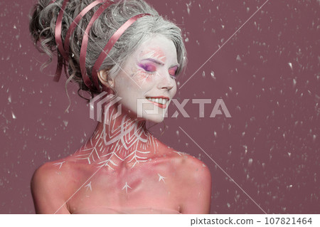 Beautiful sensual woman Snow queen. Perfect lady fashion model with carnival winter makeup with snow 107821464