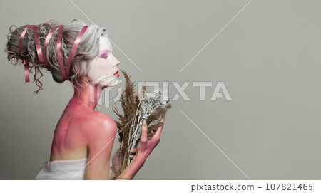 Elegant magnificient glamorous fashion model Snow Queen or Winter Witch with perfect fantasy makeup  107821465