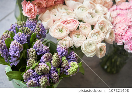 Many different flowers on Showcase. Background of mix of flowers. Beautiful flowers for catalog or online store. Floral shop and delivery concept. Many different flowers on Showcase. Background of mix of flowers. Beautiful flowers for catalog or online store. Floral shop and delivery concept. 107821498