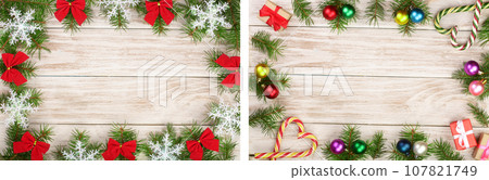 Christmas frame made of fir branches decorated with snowflakes and red bows on a light wooden background Christmas frame made of fir branches decorated with snowflakes and red bows on a light wooden background 107821749