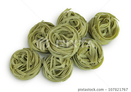 Raw tagliatelle green pasta with spinach isolated on white background. Top view. Flat lay 107821767
