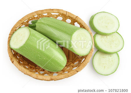 zucchini or marrow in a wicker basket isolated on white background with full depth of field. Top view. Flat lay 107821800